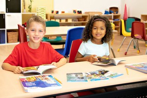 two students reading books from Exploring Reading